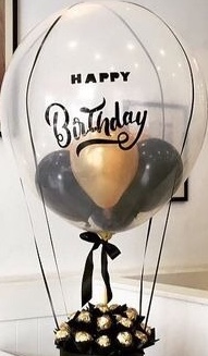 1 bubble clear balloon with happy birthday print on balloon and ferrero rocher chocolates box