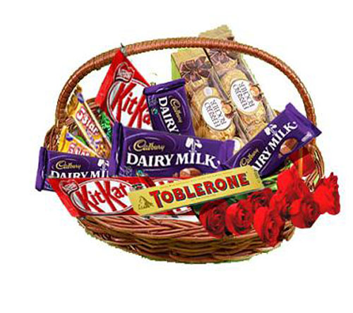 Mix chocolates basket with 5 Red roses