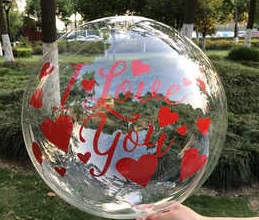 One transparent balloon with print I Love you and red hearts