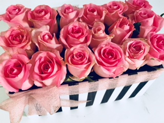 18 pink roses in striped box