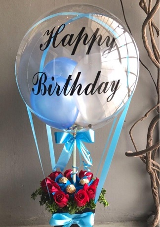 Bobo bubble transparent balloon with happy birthday print and blue balloons inside with 8 red roses 5 ferrero