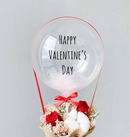 Transparent Balloon with happy valentine's day printed tied to 6 red and white roses basket