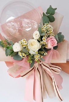Clear transparent balloons with pastel flower bouquet with net