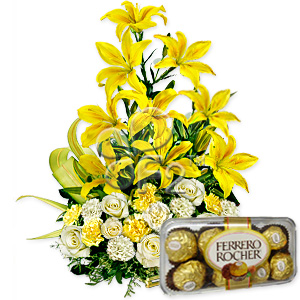 Lilies and ferrero chocolates in a basket