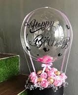 Bobo balloon with happy birthday print and basket of 12 pink roses 4 ferrero chocolates