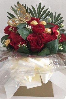16 Ferreo rocher Chocolates with 10 red roses in the same box and butterfly wrapped in clear net