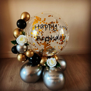 Transparent Balloon Printed Happy Birthday with gold stuffed confetti with small arch of gold silver and black balloons in small size decorated with white flowers 