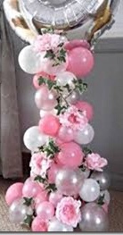 20 white pink balloons at bottom with pink flowers 1 bobo balloon on top of stick