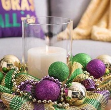 Candle decorated with colour balls and beads