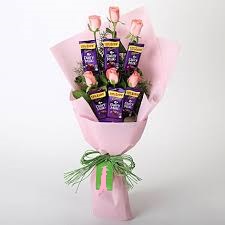 6 Pink Roses 6 dairy milk Chocolates in the same bouquet in Pink Wrapping