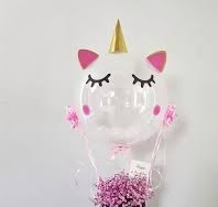bubble transparent balloon with eyes and hat pink balloons inside with pink flowers