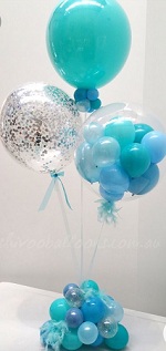3 Bobo transparent 1 stuffed with green blue balloon 1 with confetti 1 balloons with green blue small balloons tied to the balloon on a sitck with green blue balloons at bottom