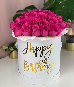 Printed happy birthday on a round silver box with 40 pink roses