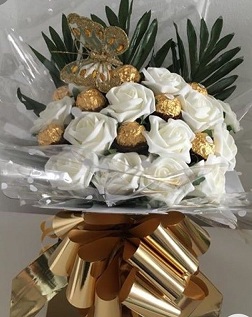 16 Ferreo rocher Chocolates with 10 white roses in the same box and butterfly wrapped in clear net