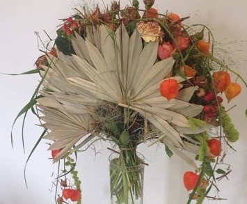 orange white pink roses with white paper cut fans hand held bouquet style