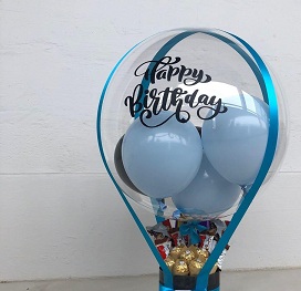 1 bubble clear balloon with happy birthday print on balloon and ferrero rocher chocolates box