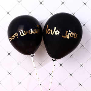 2 Black balloons saying happy birthday and Love you
