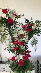 Red Roses and White Lilies on wooden branches