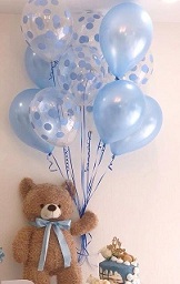 12 inches Teddy holding 10 plain blue and blue polka dotted blue balloons on sticks