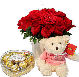 12 Red Roses and heart shaped chocolate box with Teddy 6 inches