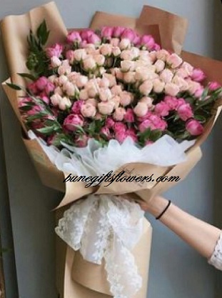 Life size tall flower bouquet with pink and red roses