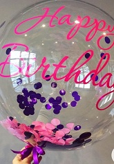 Light up bobo balloons with confetti and happy birthday print with string of led lights