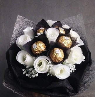 16 Ferreo rocher Chocolates with 10 white roses Bouquet wrapped in black and white