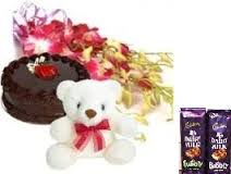 1/2 kg cake 2 silk chocolates 6 orchids and teddy bear 6 inches