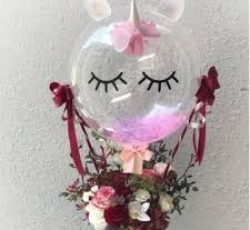 bubble transparent balloon with eyes and hat pink white balloons inside with flowers