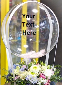 Transparent Balloon Printed WITH YOUR TEXT in 3 words only Tied with ribbons to a basket of 12 white Pink Roses