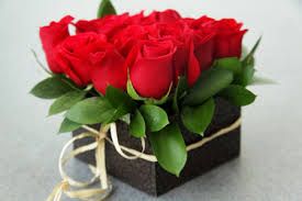 10 Red Roses in a square small black box with ribbon