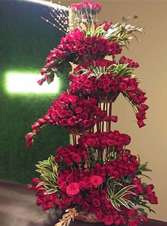 Life size tall flower arrangement 3-4 feet 4 tier red roses in bunch style and drooping flowers