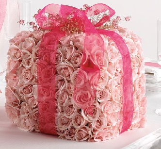 100 Pink roses in the shape of a box Tied with pink ribbon