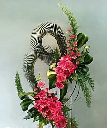 30 Pink rose and pink Gerberas in 2 tier standing arrangement with curved palm leaves