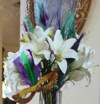 White lilies with masque and feathers
