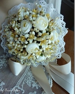 8 white roses hand bouquet with doyley wrapping